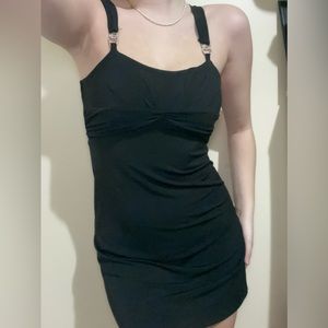 Little black dress with jewels on the straps.